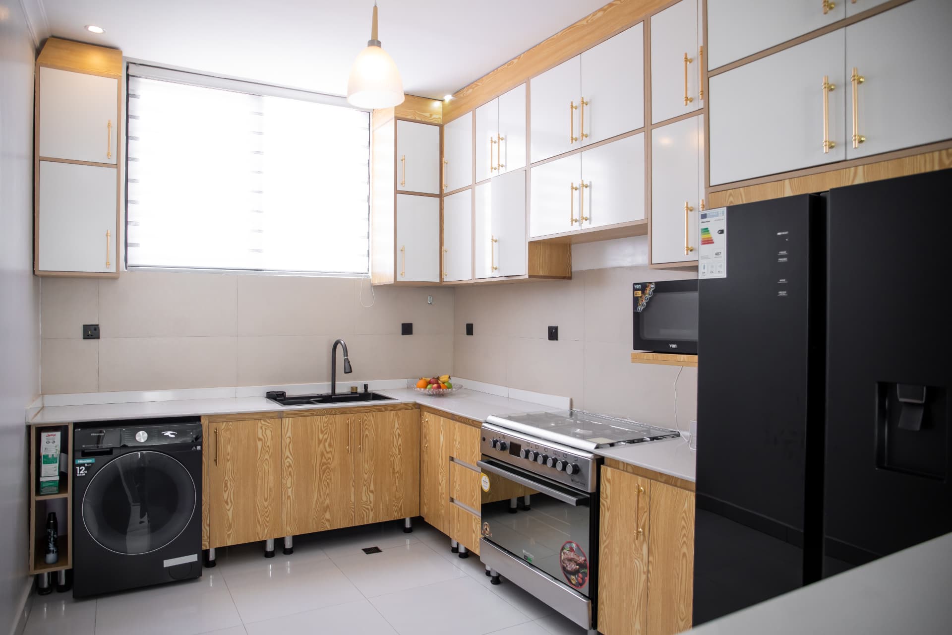 Full kitchen with gas range and side-by-side refrigerator
