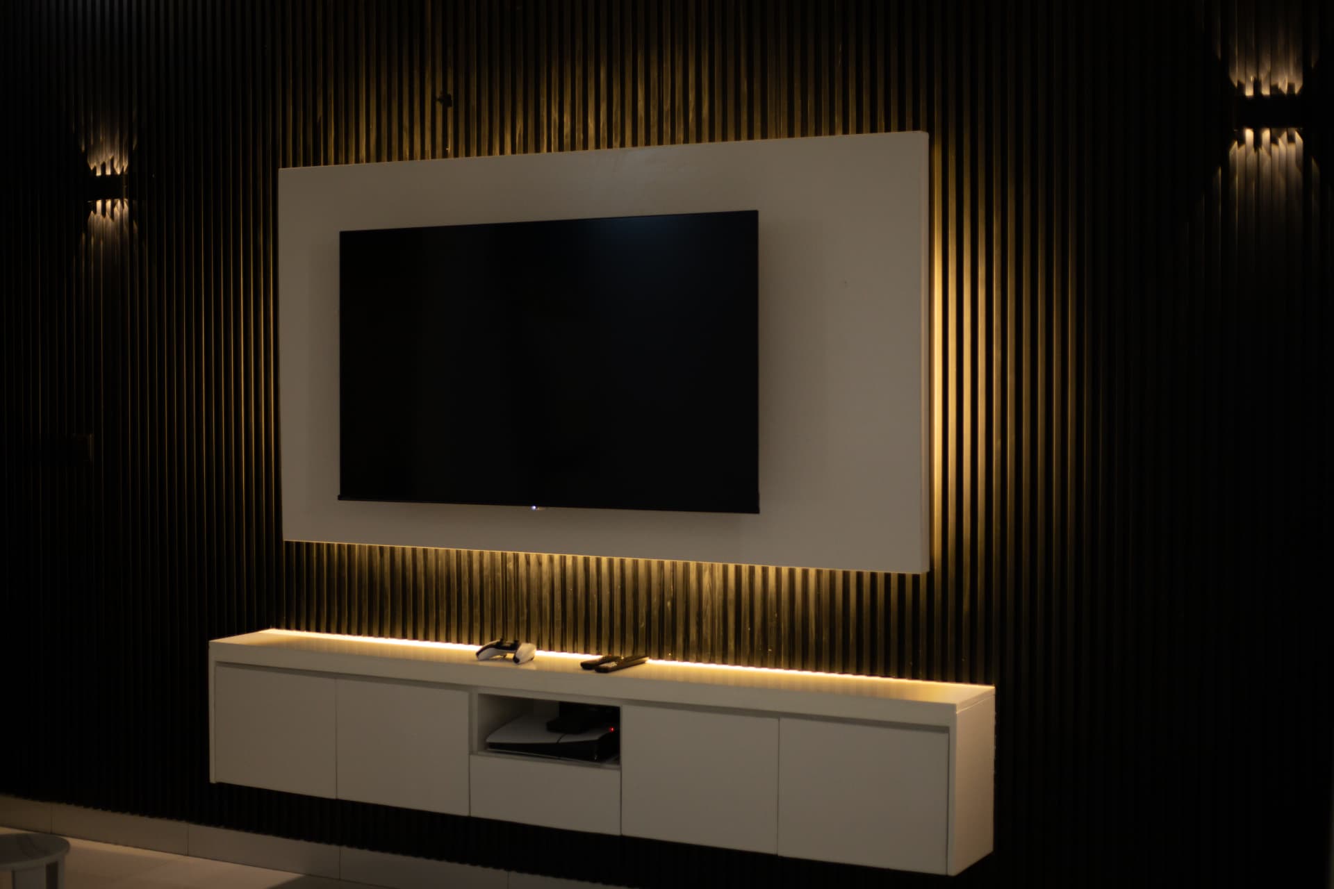 Backlit media wall with fluted timber panelling